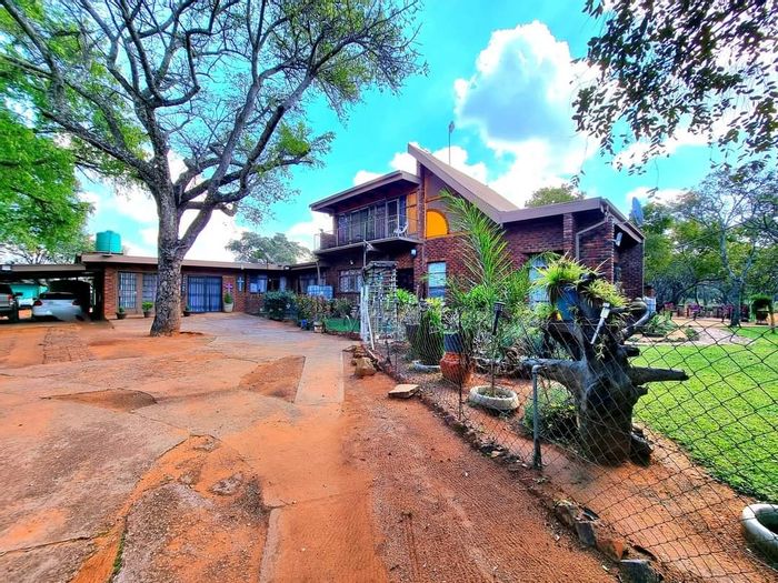 Farm for Sale in Modimolle Rural: 12.84ha, equipped boreholes, fruit orchard, security features.