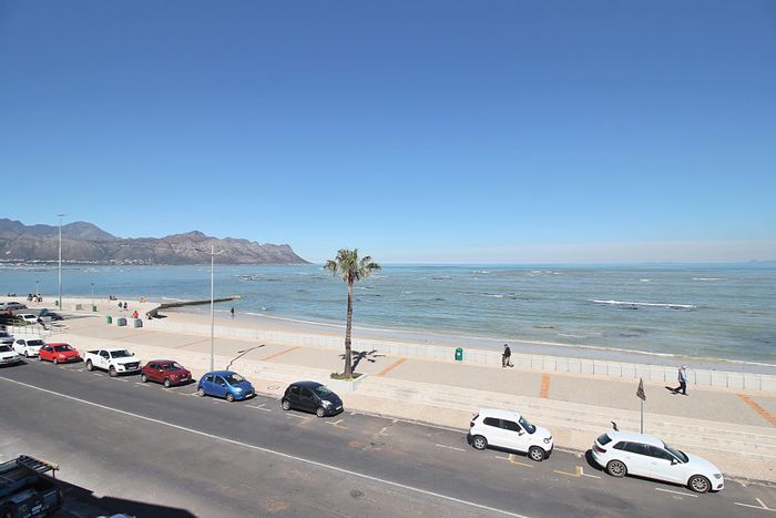 Beachfront apartment in Strand North for sale, featuring ocean views and garage.