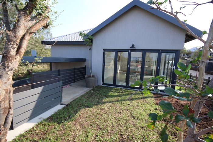 Two-bedroom house for sale in Hoedspruit Central with secure access and garden.