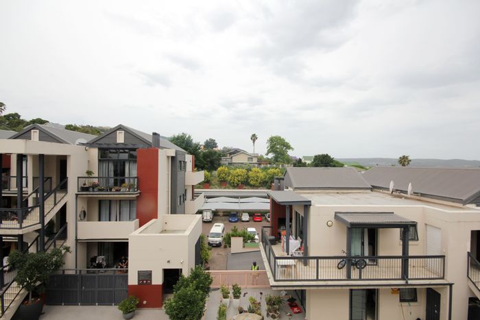 Knysna Central Apartment For Sale: 2 beds, balcony, rental demand, close to amenities.