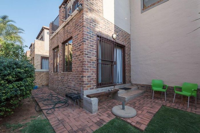 For Sale: Secure Ruimsig Townhouse with Private Garden, Double Garage, and Modern Amenities