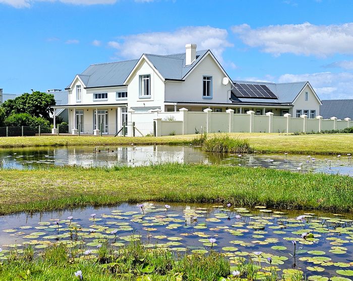 For Sale: House in Kingswood Golf Estate with pool, solar, and golf course views.