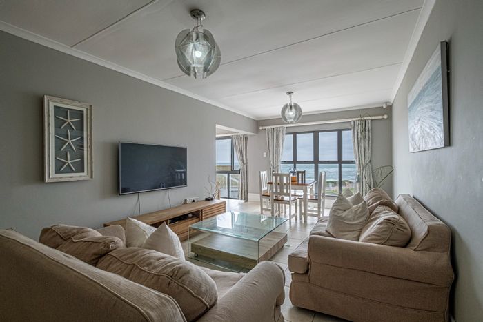 Beachfront apartment in Summerstrand with pool, parking, and security features. For Sale.