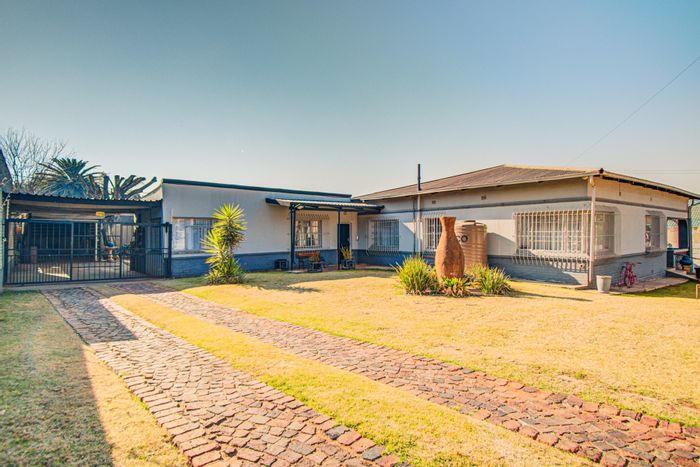 House for Sale in Primrose: 3-bed home with cottage, spacious yard, and braai area.