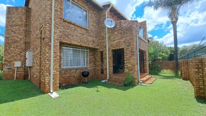 Ground floor townhouse in Zwartkop for sale, features garden and double garage.