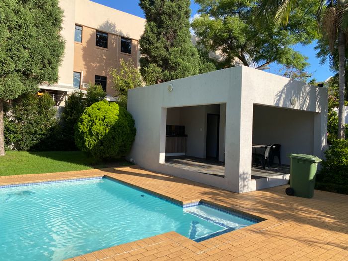 Morningside Apartment For Sale: Secure top floor, pool, braai facilities, close to amenities.