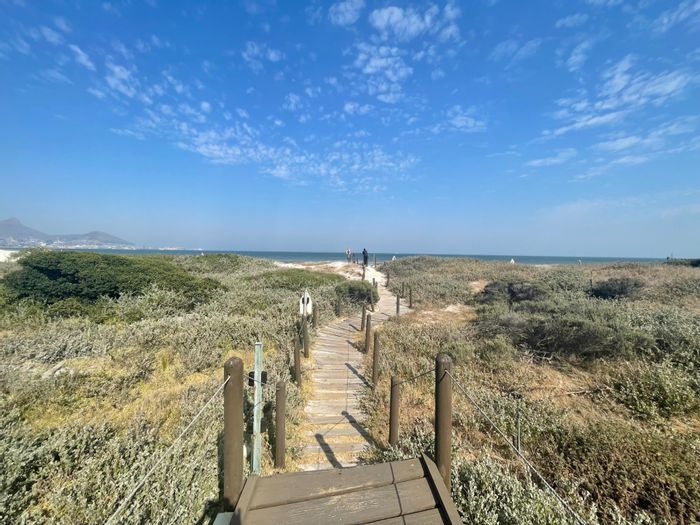 2-Bedroom Apartment To Rent in Lagoon Beach with beach access and communal pool.