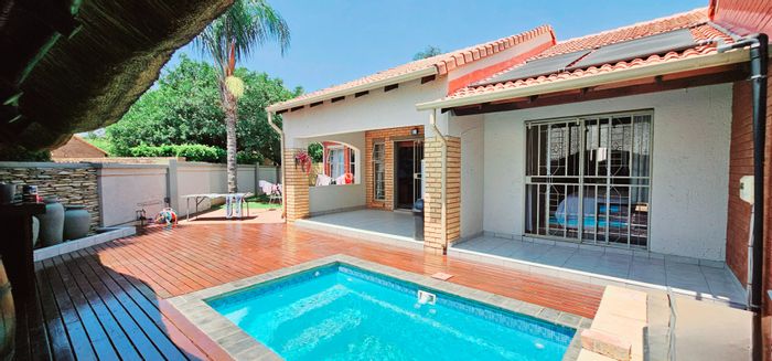 For Sale: Equestria townhouse with 3 bedrooms, private pool, and wrap-around garden.