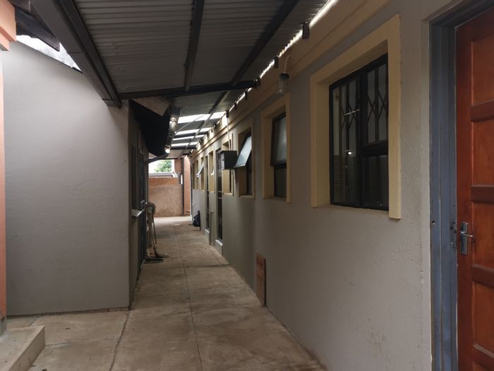 For Sale: House in Soshanguve Ext with 8 bachelor units and communal spaces.