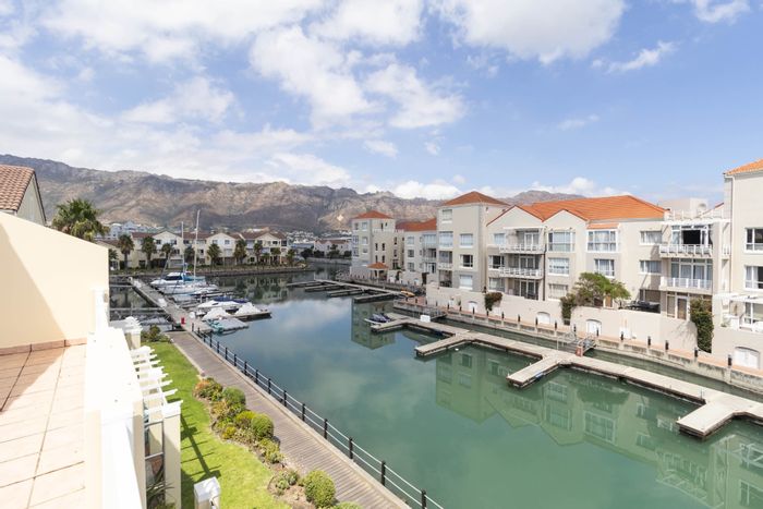 Harbour Island Apartment For Sale: Balcony views, clubhouse, pool, and boat moorings.