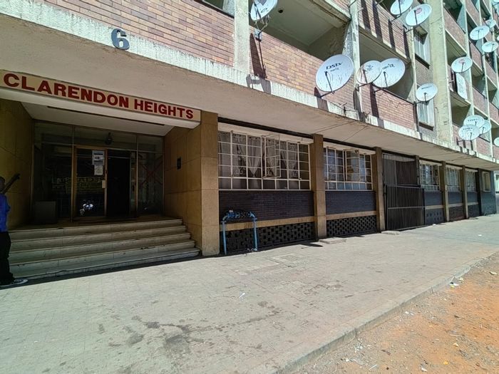 For Sale: Hillbrow Apartment with 3 Bedrooms, Enclosed Balcony, and Strong Rental Income.