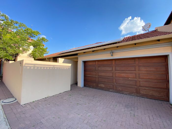 Secunda Central Townhouse For Sale: Secure complex, spacious living, double garage, solar power.