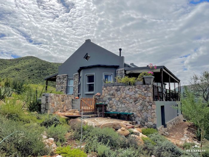 Calitzdorp Rural Small Holding For Sale: Off-grid living, river frontage, community amenities.