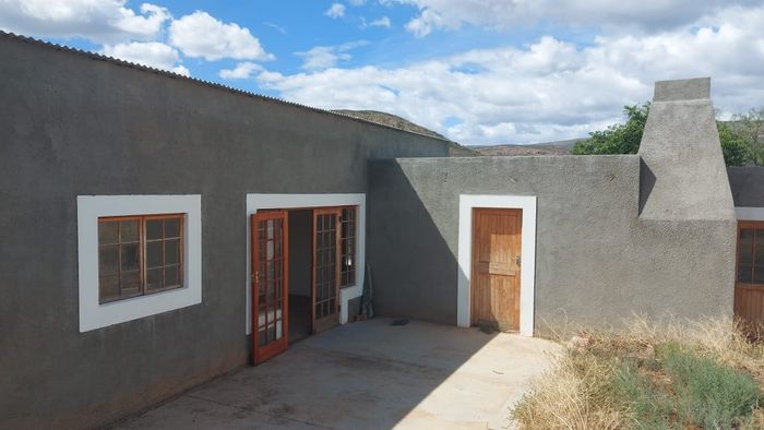 Ladismith Rural Small Holding For Sale: Renovated home, mountain views, eco-tourism potential.