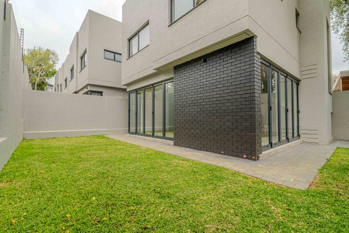 Modern 4-Bedroom Townhouse for Sale in Bryanston with Private Garden and Security.