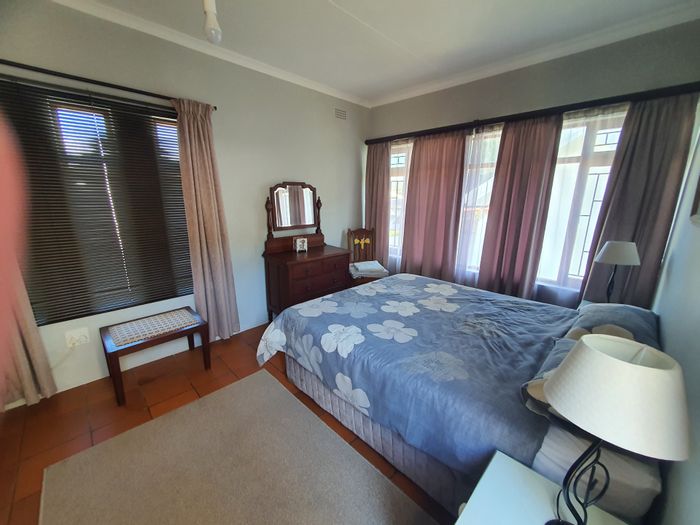 For Sale: Bayview House with Granny Flat, Courtyard, Double Garage, and Low Maintenance Garden.