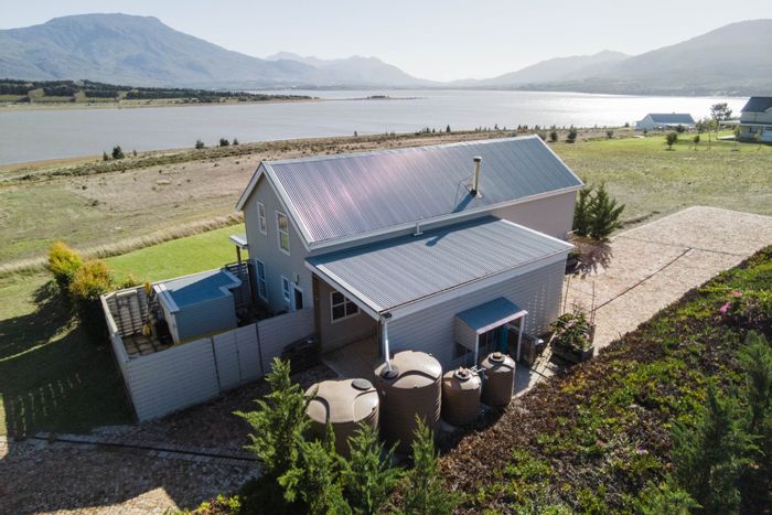 House For Sale in Theewaterskloof: Waterfront access, spacious interiors, exclusive estate living.