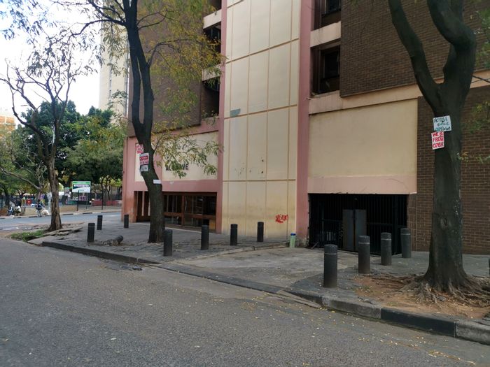 Hillbrow Apartment For Sale: 2 Bedrooms, parking, security, and rental potential.