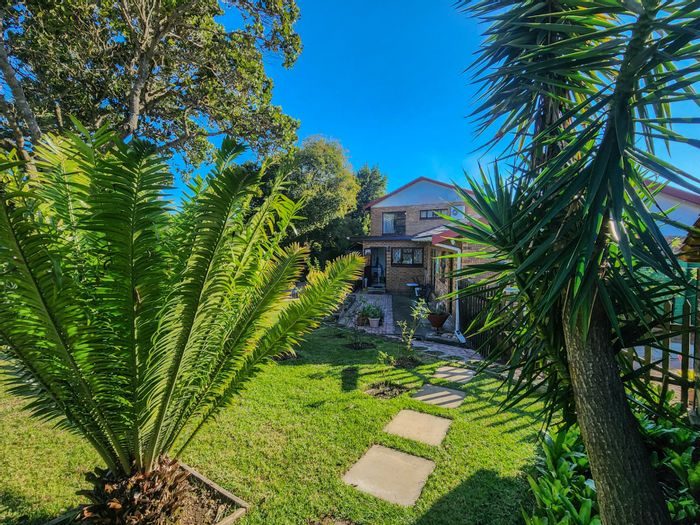 Rexford House For Sale: Five bedrooms, four garages, sunroom, and garden shed.