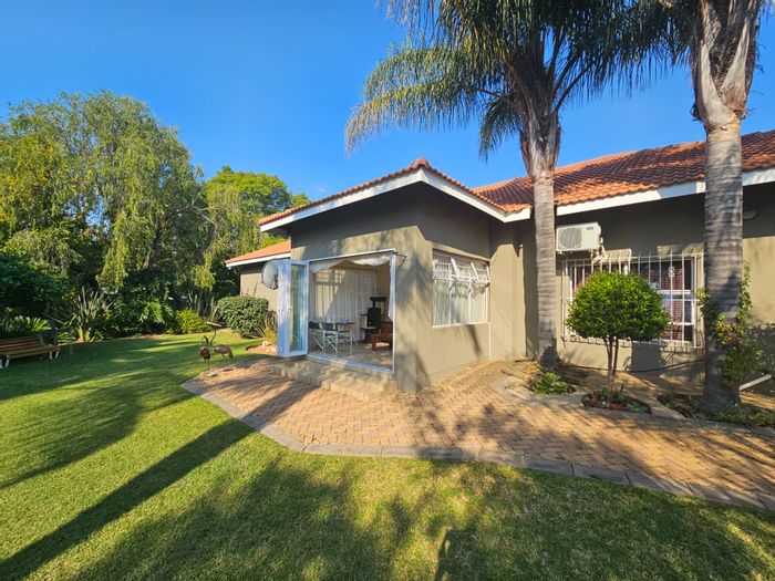 Spacious Lydenburg Central house with garden, multiple carports, and ample storage. For Sale.