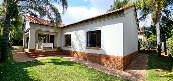 House For Sale in Olympus AH: 3 beds, communal pool, wrap-around garden, double garage.