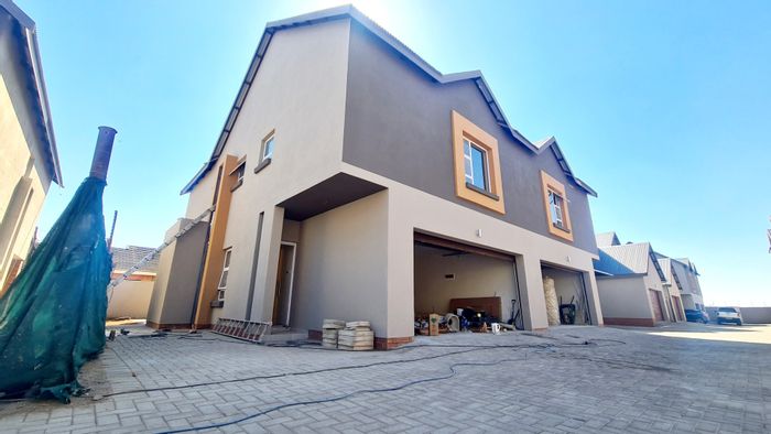 For Sale: Bendor Townhouse with open plan living, double garage, and ample parking.