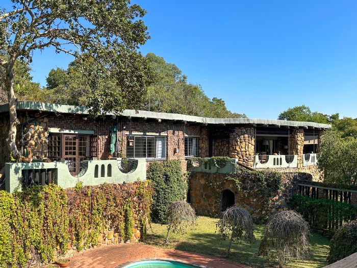 For Sale: Unique stone house in Nelspruit Ext 9 with garden, pool, and library.