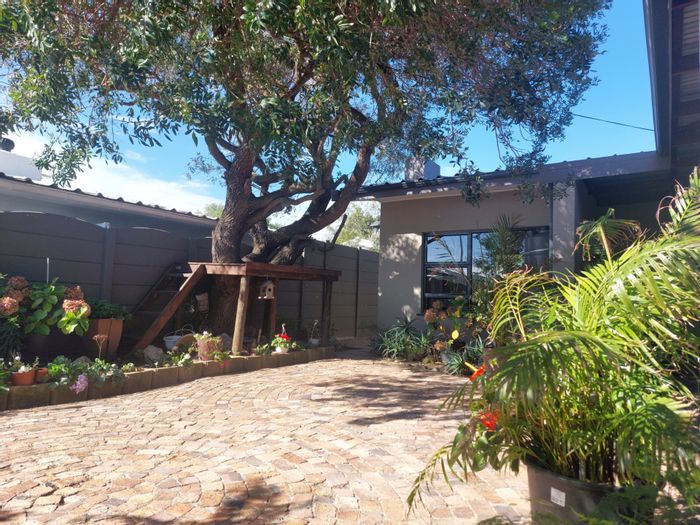 Charming Strand North House for Sale: Beach Proximity, Braai Area, Ample Parking, Secure Living