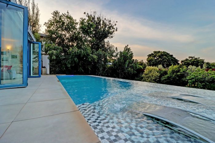 House For Sale in Waterkloof Ridge: Spacious layout, pool, cinema, and secure location.