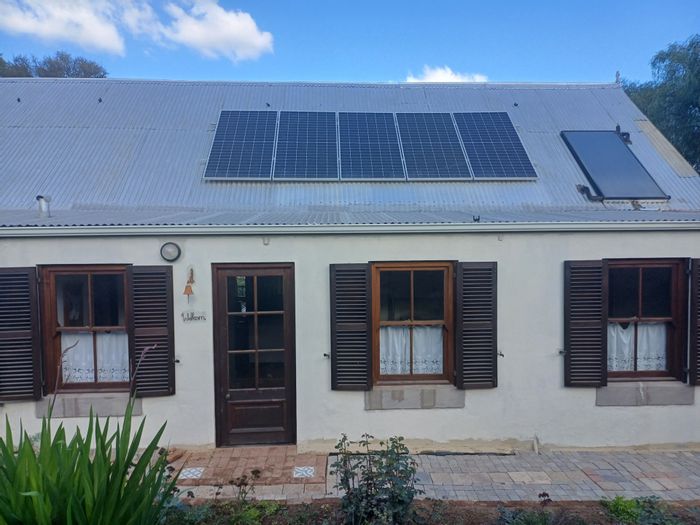 Historic Van Wyksdorp house with large stand, vineyard, and solar power for sale.