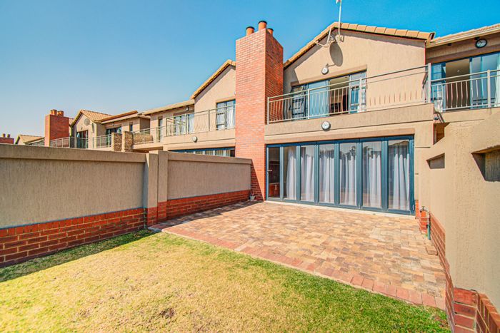 For Sale: Townhouse in Ebotse Golf Estate with double garage, private patio, and inverter.