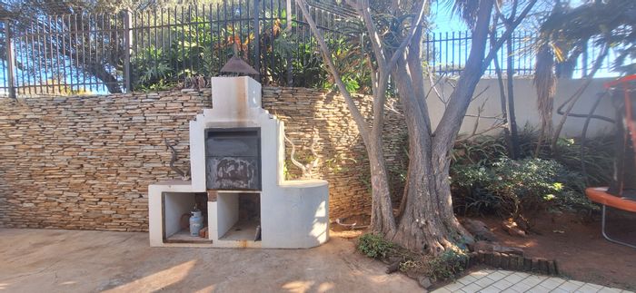 For Sale: Townhouse in Constantia Park with private garden, pet-friendly, and two garages.