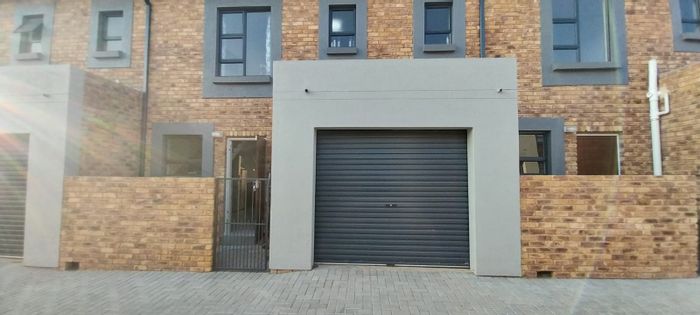 For Sale: Townhouse in Rand Collieries with garage, open plan living, and security.