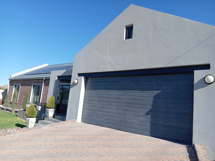 House For Sale in Spandauville: 3 bedrooms, pool, garage, eco-friendly features.