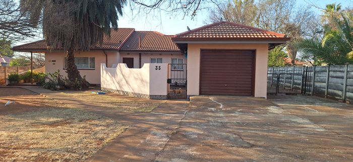 House for Sale in Westonaria Central: 3 bedrooms, spacious garden, garage, and carport.