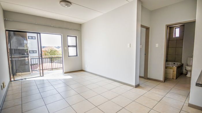 Elarduspark Apartment For Sale: 24-hour security, patio with braai, ample storage.