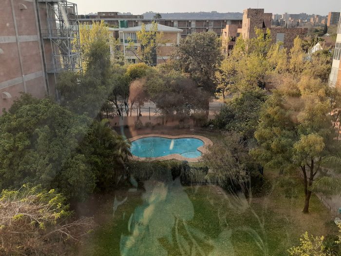 Sunnyside Apartment For Sale: Includes garage, pool, braai area, and security features.