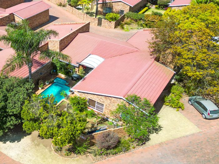 For Sale: Buccleuch Townhouse with pool, garden, garage, and 24-hour security.