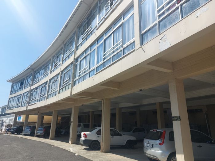 Spacious 2-bedroom apartment in Strand Central with secure parking and mountain views. For Sale.