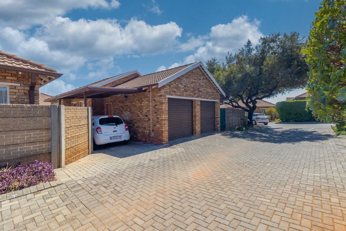 Townhouse for Sale in Weltevreden Park: 2 beds, pet-friendly garden, double garage.