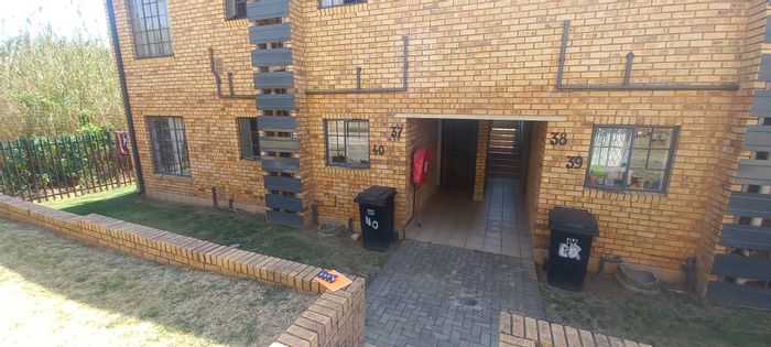 Ground Floor Apartment For Sale in Weltevreden Park with carport, playground, and braai area.