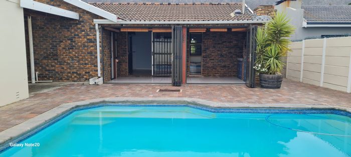 Dobson House For Sale: Open plan living, indoor braai, pool, double garage.