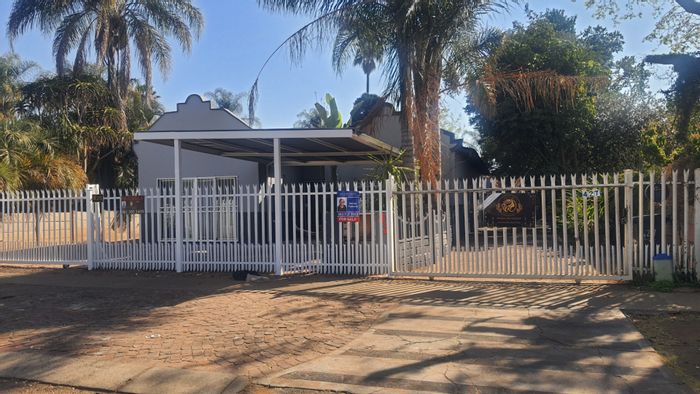 For Sale: Two houses, two flats, ample parking, prime Pretoria North location.