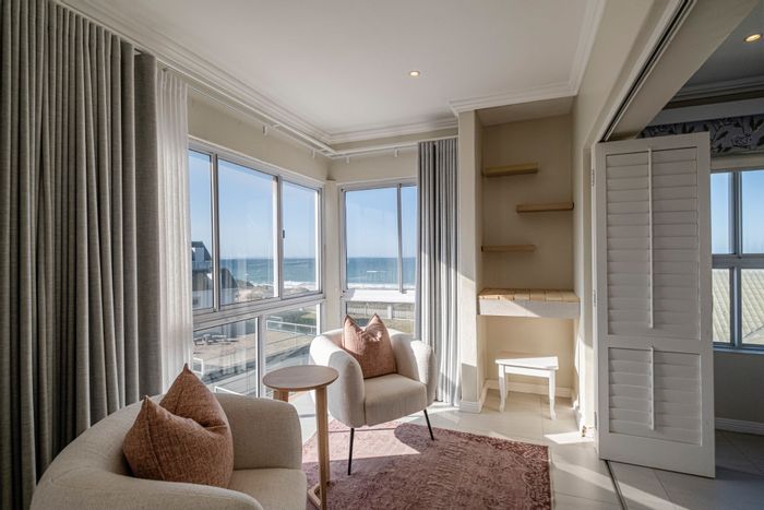 Beachfront townhouse in Summerstrand for sale: sea views, gated complex, pool access.