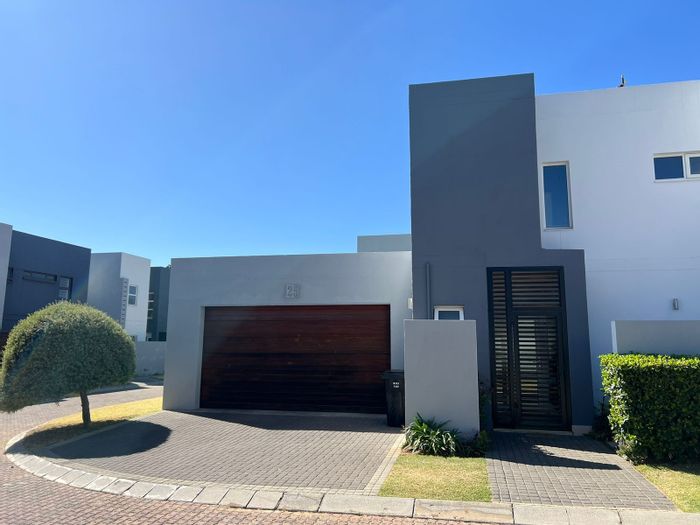 For Sale: Noordwyk Townhouse with 2 beds, garden, patio, double garage, security.