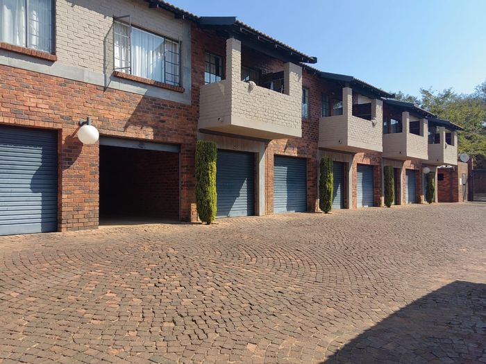 For Sale: 2-bedroom apartment in Pretoria North with garden, carports, and security.