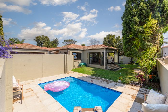 For Sale: Cluster in Broadacres with pool, garden, and secure estate living.