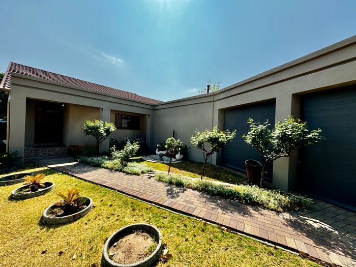 For Sale: House in Sunset Park with indoor braai, landscaped garden, and solar panels.