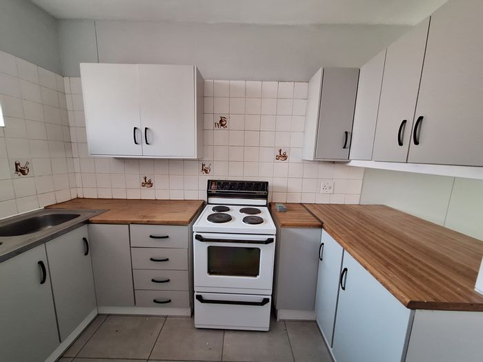 For Sale: Apartment in Wonderboom South with pool, braai area, and secure parking.