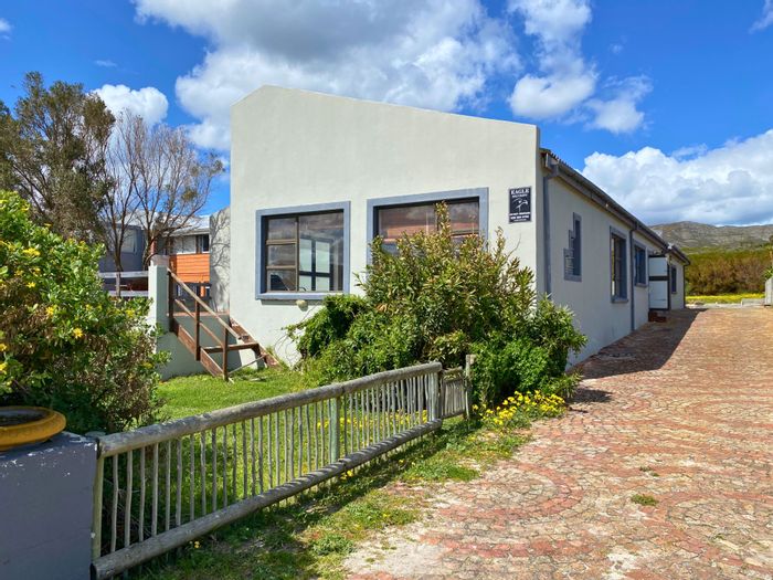 For Sale: 4-Bedroom House with Flatlet in De Kelders, ideal renovation opportunity.